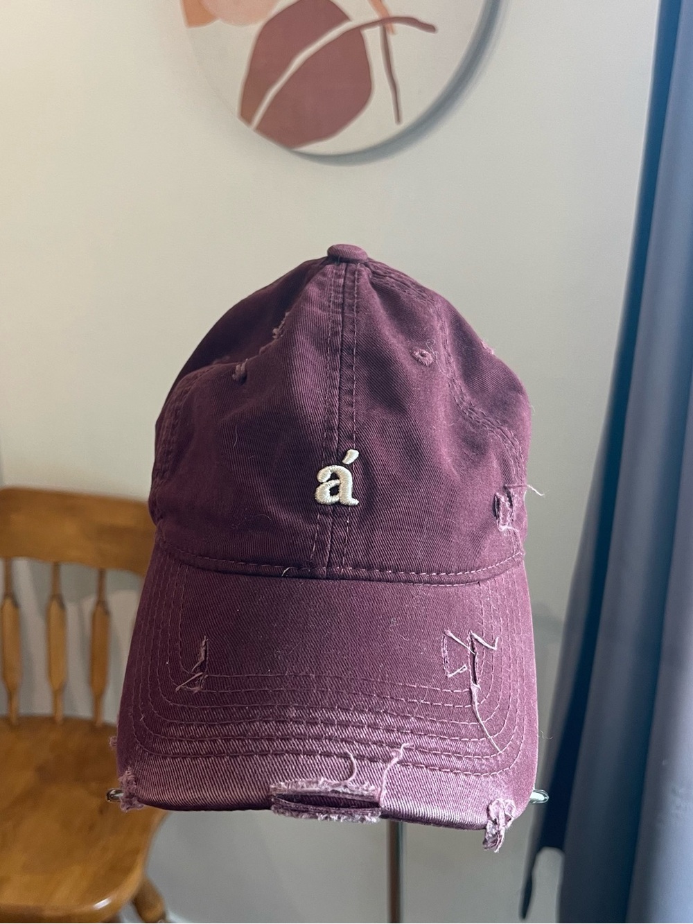 Burgundy Distressed Baseball Cap with 'á' Accent Logo